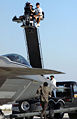 NBC Universal cameramen capture the action as actor Tony Shalhoub, who plays detective Adrian Monk, runs to capture the "bad guy" who attempts to escape in an F/A- 22 Raptor during the filming of an upcoming episode of "Monk".