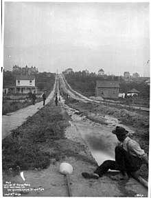 Laying main pipe on E Harrison St, Seattle, September 8, 1899 (SPWS 498).jpg