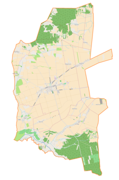 Mapa konturowa gminy Skomlin, blisko centrum na prawo u góry znajduje się punkt z opisem „Wichernik”