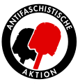 Logo gambar bendera diganti sikat toilet dalam rangka Demonstrasi Hamburg 2013-2014, Antifaschistische Aktion (Jerman).