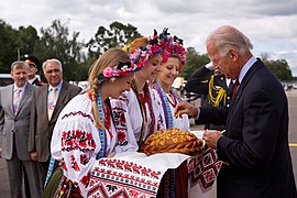 Vice President Joe Biden dips a piece of bread in salt as part of a welcoming ceremony upon his arrival in Kyiv, Ukraine, July 20, 2009.