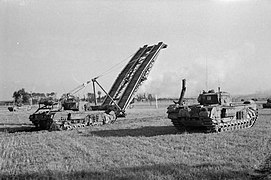 A Churchill AVRE with Small Box Girder Bridge and a Churchill Crocodile flame-throwing tank in 1945