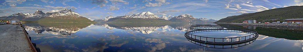 View of Lyngen alps and fjord from E6 across fjord