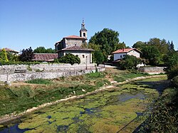 View of the Zalla river and the parish church in Foronda