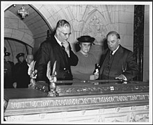 John Curtin and Mrs Curtin with Canadian Prime Minister Mackenzie King, examining Book of Remembrance in Memorial Chamber, Peace Tower, in Parliament House, Ottawa, 1944 (18658896658).jpg