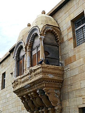 This ancient balcony is in the 'Koteshwar Temple' complex, in Kutch, on the western border of India, close to the river Indus. it is now covered and not used. For more details see wikipedia link of 'Koteshwar, Kutch'