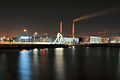 View of Les Bains Des Docks at night from across the water.