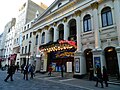 Image 63Music hall evolved into variety shows. First performed in 1912, the Royal Variety Performance was first held at the London Palladium (pictured) in 1941. Performed in front of members of the Royal Family, it is held annually in December and broadcast on television. (from Culture of the United Kingdom)