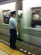 Hibiya line station staff uniform - October 2014.jpg