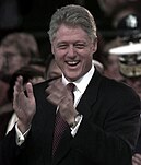 portrait photo of a man clapping his hands