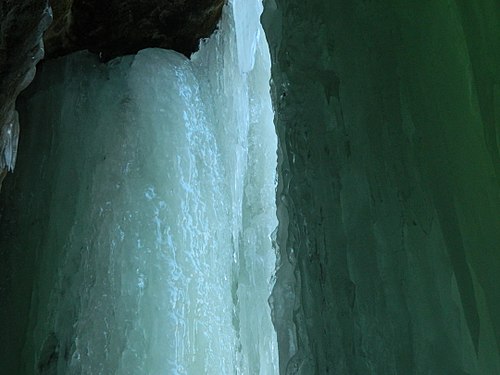 An image taken in the Eben Ice Caves. This is a seasonal tourist attraction in the Upper Peninsula of Michigan. This particular image is of ice flowing down onto a small rock shelf.