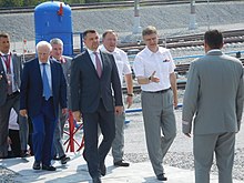 A group of formally-dressed men outdoors