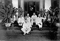 Group portrait on the stairs of the veranda of a house