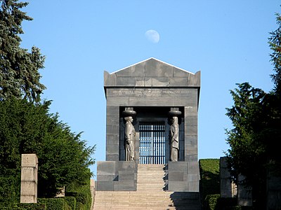 Art Deco caryatids of the Monument to the Unknown Hero, atop Mount Avala, south-east of Belgrade, Serbia, wirhcaryatids representing all the peoples of the Kingdom of Yugoslavia, by Ivan Meštrović, 1934–1938[30]