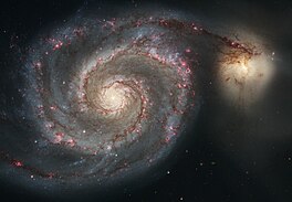 Die Draaikolksterrestelsel of Messier 51A (links). Die kleiner voorwerp regs bo is M51B of NGC 5195. (Bron: Nasa/ESA)