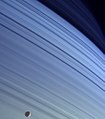 Mimas, silhouetted against Saturn's northern latitudes.