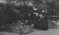 'In a Haven of Peace' (Illustrated London News): Nuns and village children at the grave of Redmond at Locre in June 1917