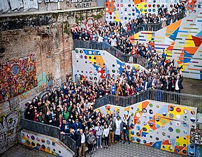 Wikimedia Summit 2019 group photo; by railing in center