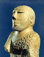 Statue of the "Priest King" wearing a printed robe, Mohenjo-daro, Indus Valley civilization, c. 2000–1900 BCE.