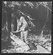 John Hornby using an adze to build a frontier cabin - N-2002-005-0199.jpg