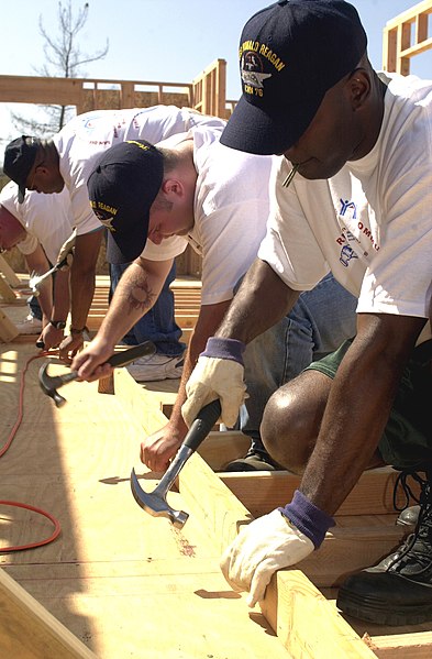 File:US Navy 040623-N-8977L-009 Sailors assigned to Nimitz-class aircraft carrier USS Ronald Reagan (CVN 76) construct wall framing while helping the non-profit group Habitat for Humanity build homes.jpg