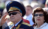 Former Soviet cosmonaut and first space walker Alexei Leonov with his wife during the parade