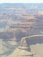 Dramatic Redwall Limestone cliffs, on ridgeline (cliffline) south, and part of the Tower of Set, East Granite Gorge (Inner Gorge, Grand Canyon)