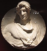 Begram medallion showing a young man wearing a chlamys; c. 1st century AD.