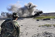 Third Phase A student detonates an explosive charge on San Clemente Island as part of his basic demolitions training.