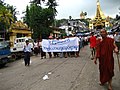 Image 21Protesters in Yangon with a banner that reads non-violence: national movement in Burmese, in the background is Shwedagon Pagoda. (from History of Myanmar)