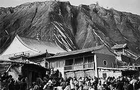 Muslims and a mosque, the prayer-hall, minaret, market, mountain, Dongxiang County, Gansu, 1934.jpg