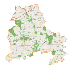 Mapa konturowa powiatu brzezińskiego, blisko centrum na prawo znajduje się punkt z opisem „Doliska”