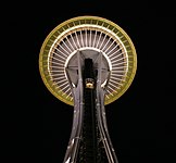 The bottom of the Space Needle at night.