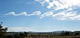 Wave clouds forming over Mount Duval, NSW, Australia