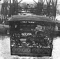 Gondola carrying passengers and cars, 1932.