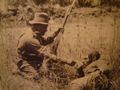 An ANZAC soldier gives water to a wounded Turk