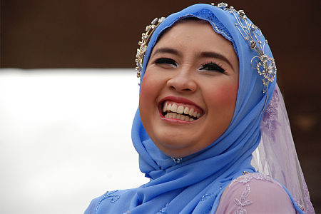 Laughing woman in Kuala Lumpur wearing a blue headscarf, 2008