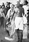 Mahatma Gandhi with Annie Besant en route to a meeting in Madras in September 1921. Earlier, in Madurai, on 21 September 1921, Gandhi had adopted the loin-cloth for the first time as a symbol of his identification with India's poor.