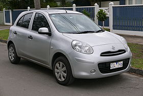 A small five-door car with hubcaps over steel wheels