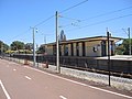 Station platforms and shelter. View from shared path on the south-east side of the railway.