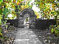 Temple enclosure wall and gate constructed using rubble stone masonry[24] with native teak trees