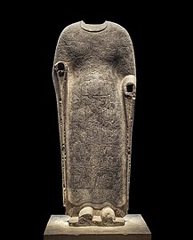 Buddha Vairocana draped in robes portraying the Realms of Existence. Limestone, Northern Qi, between 550 and 577