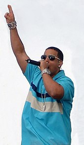 Daddy Yankee, performing, with a blue shirt.