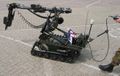 Remote controlled vehicle to clear explosives