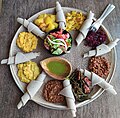 Image 26This meal consisting of injera and several kinds of wat (stew) is typical of Ethiopian cuisine. (from Ethiopia)