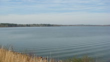 A view of the calm Lake Tobesofkee in the wintertime. Taken facing Northwest from beside the Lower Thomaston Road Bridge.