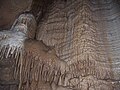 Image 25A flowstone formation inside Chimney Dome, part of Illinois Caverns in Monroe County. The cave is formed in limestone and dolomite by water dissolution and features stalactites, stalagmites, rimstone dams, flowstone, and soda straws. Photo credit: A. Frierdich (from Portal:Illinois/Selected picture)