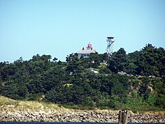 The Yaquina Bay Lighthouse from across the Yaquina River