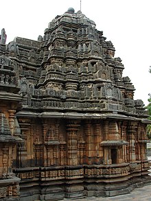 A brown temple with an ornate roof