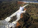 Water flowing from Oroville Dam's eroded spillway